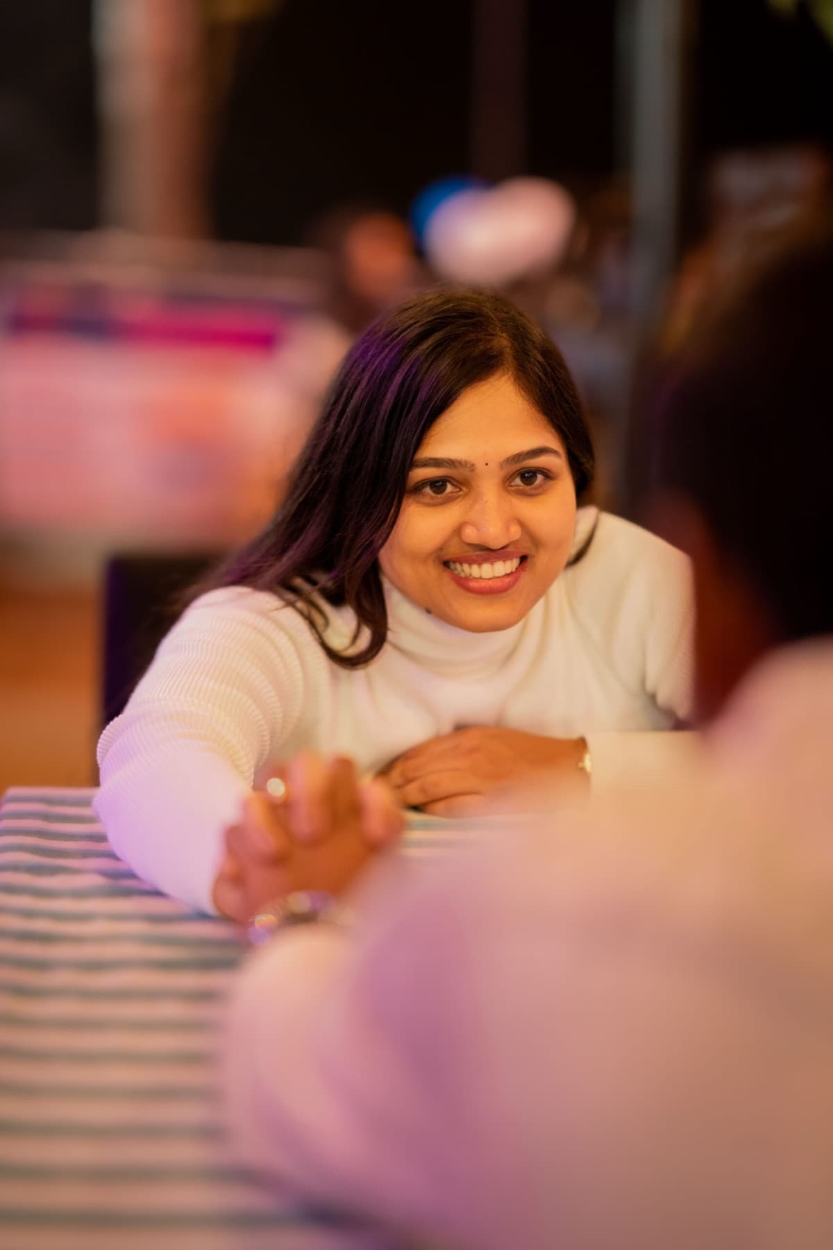 Candid smile captured at a cafe