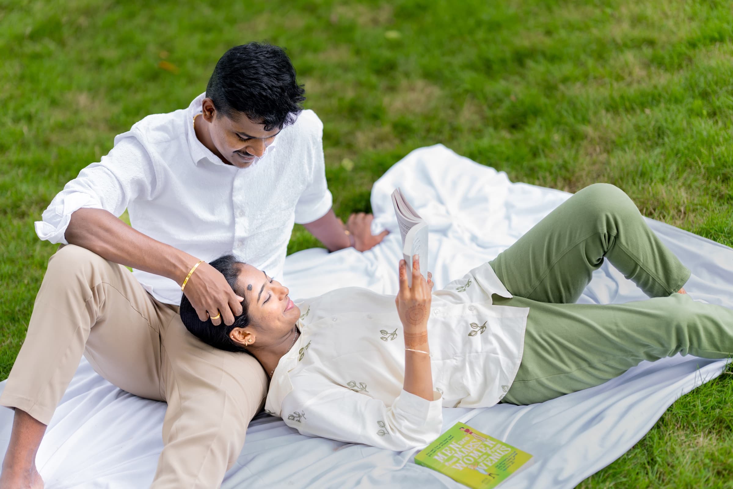 Couple sharing a relaxed picnic on the lawn