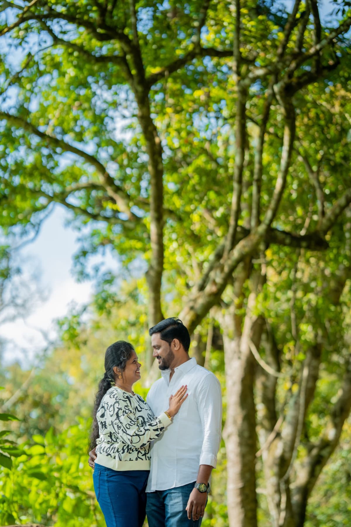 Couple portrait under large trees