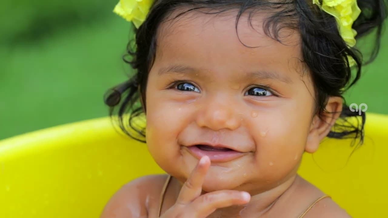Candid baby photoshoot by Aruna Photography